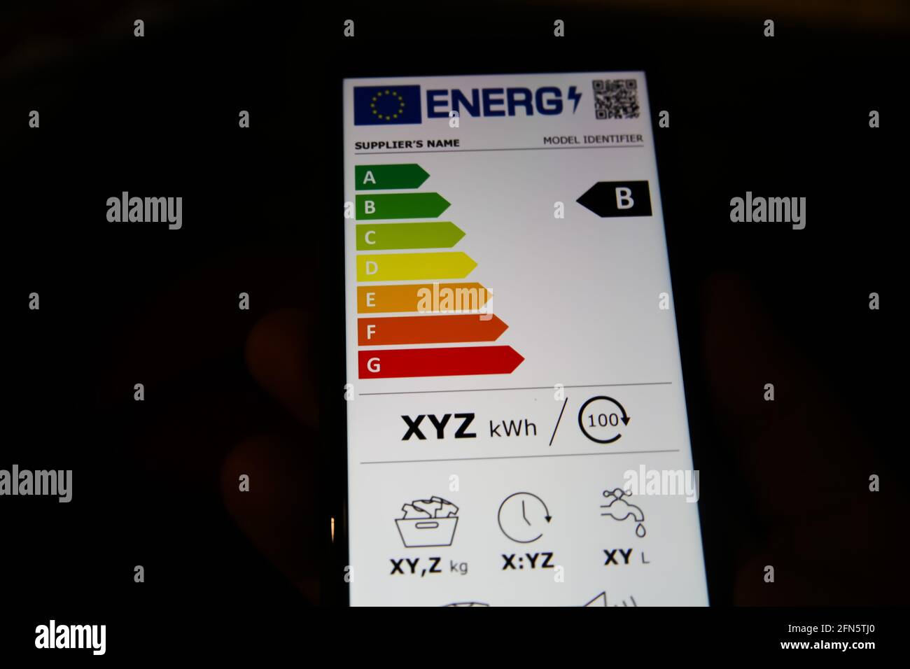 Viresen, Germany - May 8. 2021: Closeup of mobile phone screen with new european union energy label efficiency classes A - D, blsck background Stock Photo