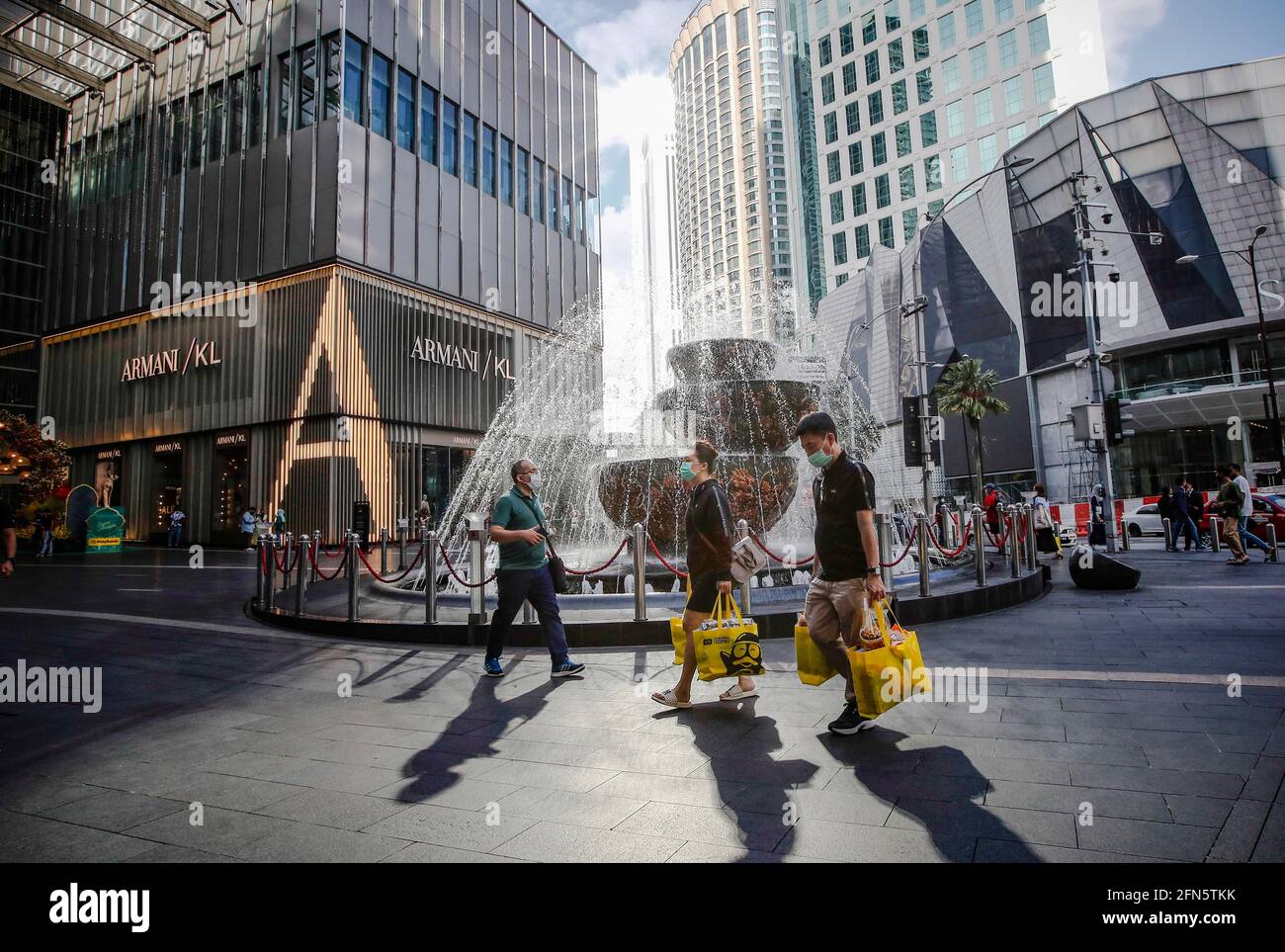 Kuala Lumpur, Malaysia. 14th May, 2021. People wearing face masks as a  precaution against the spread of the coronavirus seen walking along a  Pavilion shopping mall during the second day of the