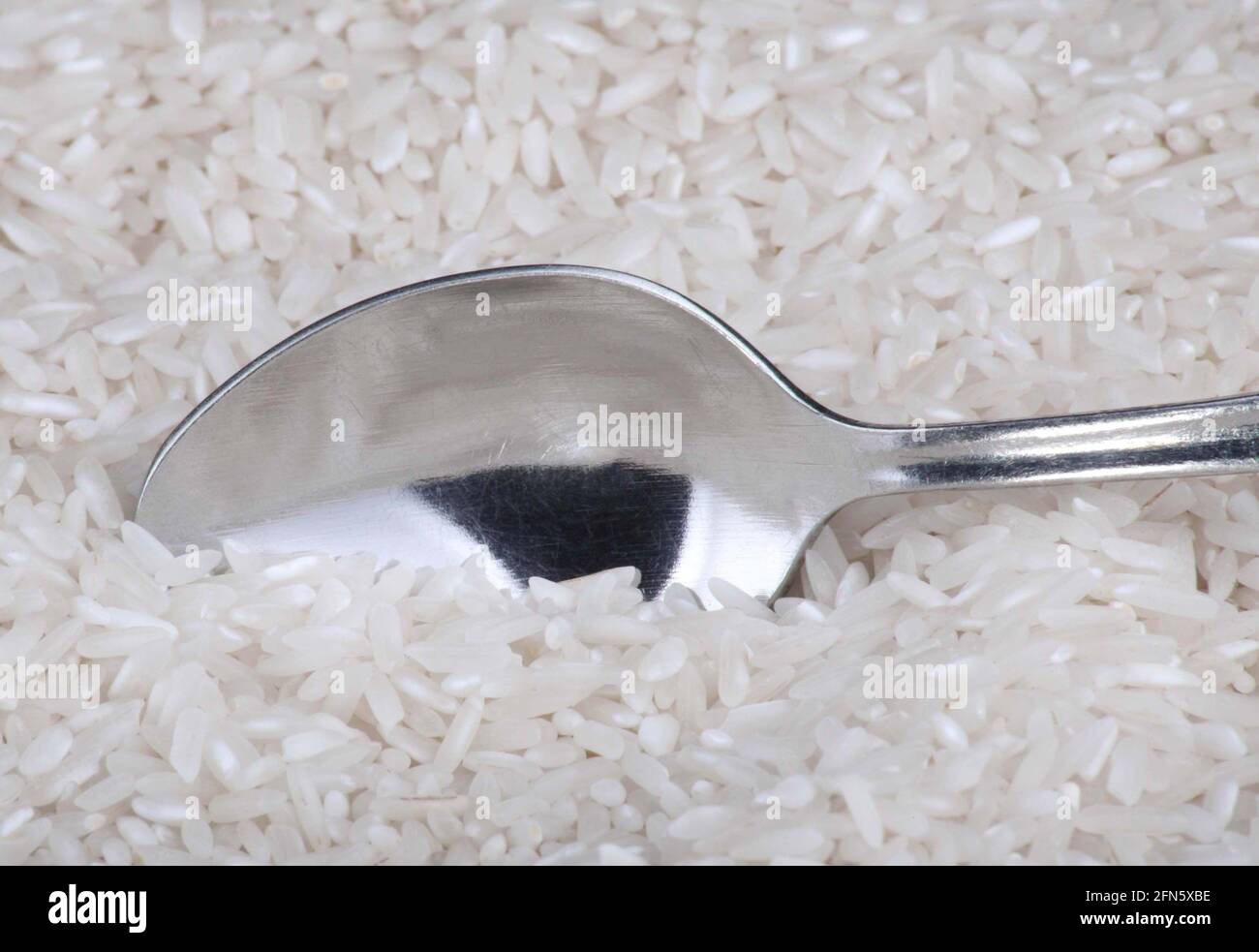 rice food background and teaspoon Stock Photo Alamy