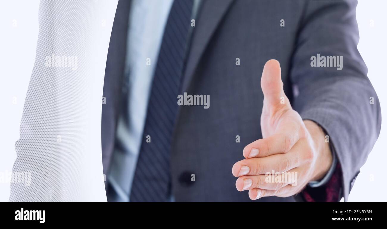 Mid section of businessman approaching for a hands shake against grey technology background Stock Photo