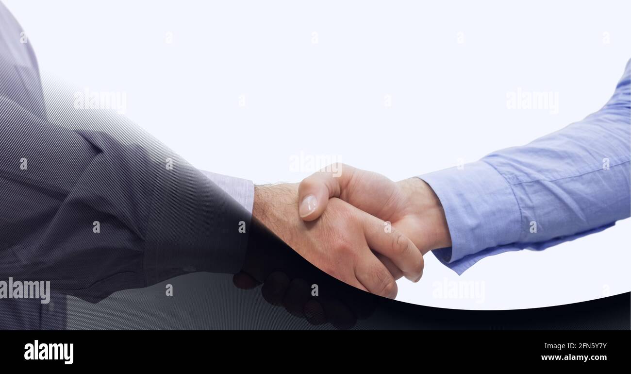 Mid section of two businessmen shaking hands against grey technology background Stock Photo