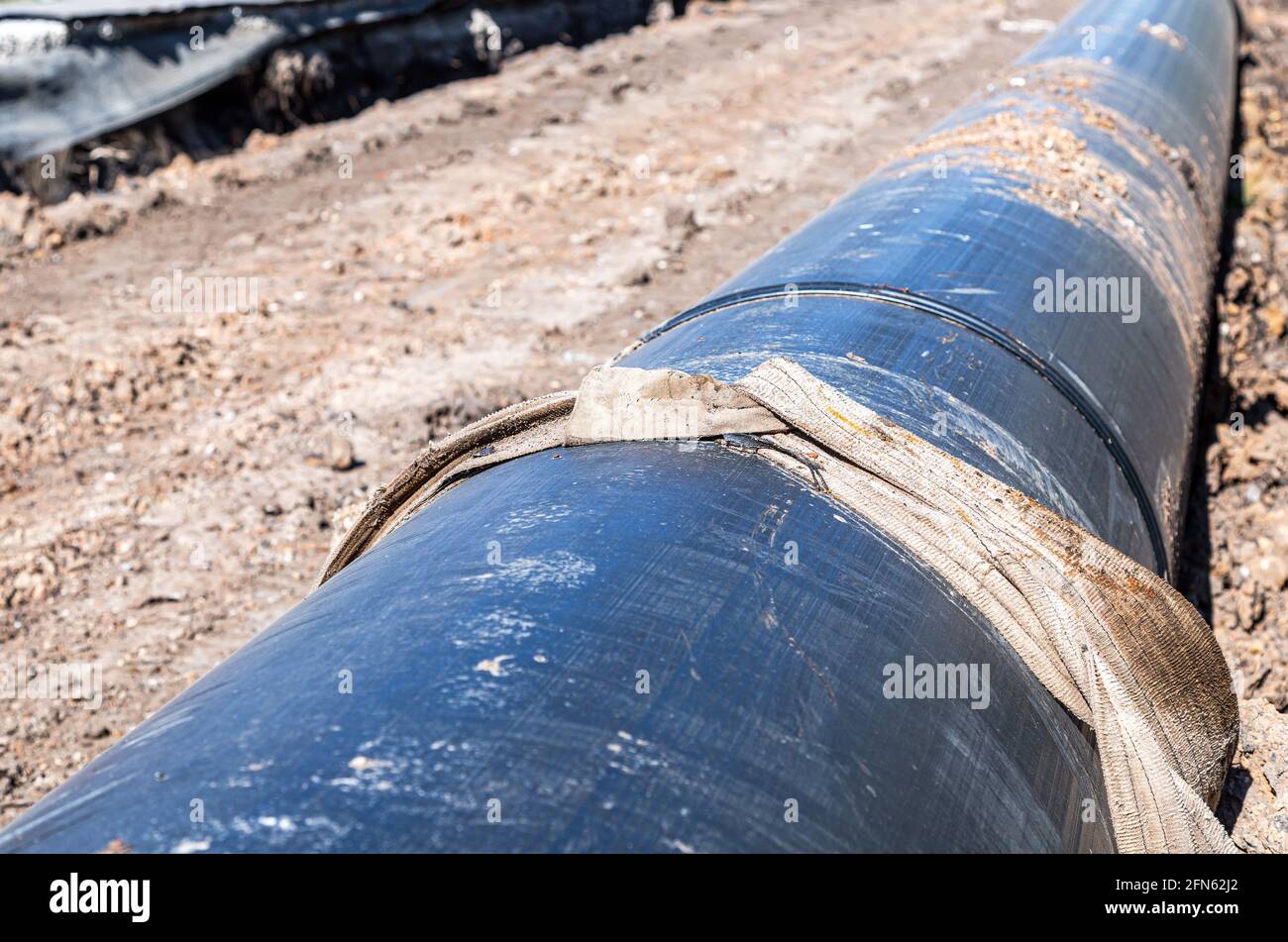 Laying large diameter plastic pipes for water supply Stock Photo