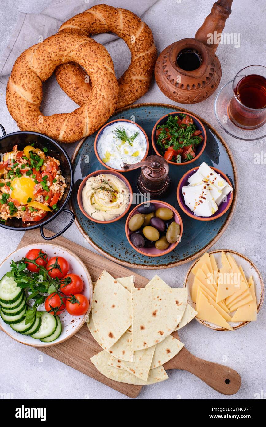 Traditional Turkish breakfast with meze and simit Stock Photo
