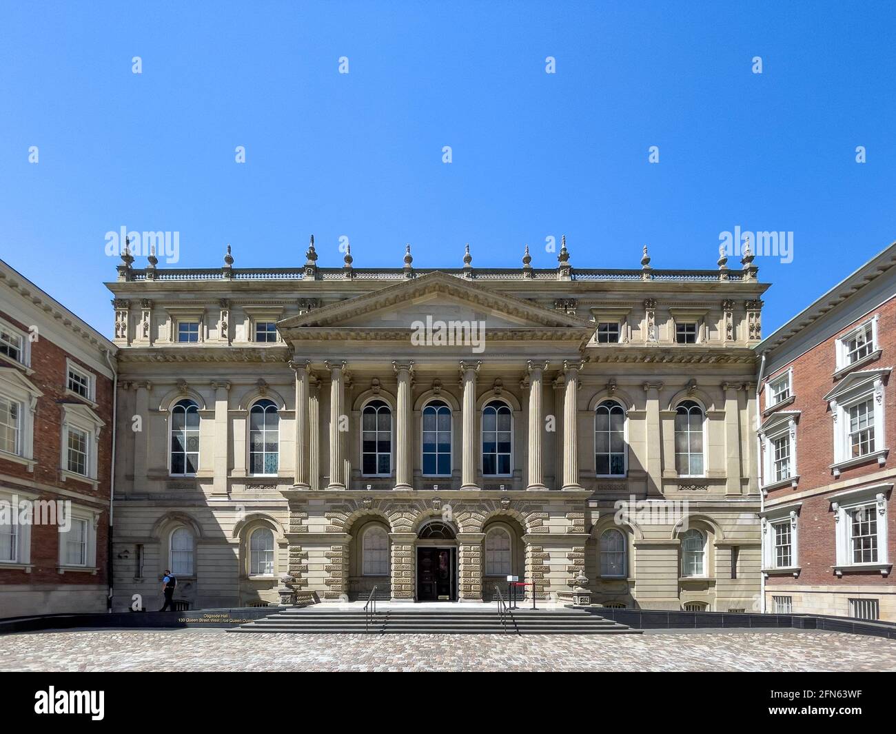 Osgoode Hall with a  late Palladian architectural style. The landmark is placed in the downtown district by the Nathan Phillips square in Toronto, Can Stock Photo