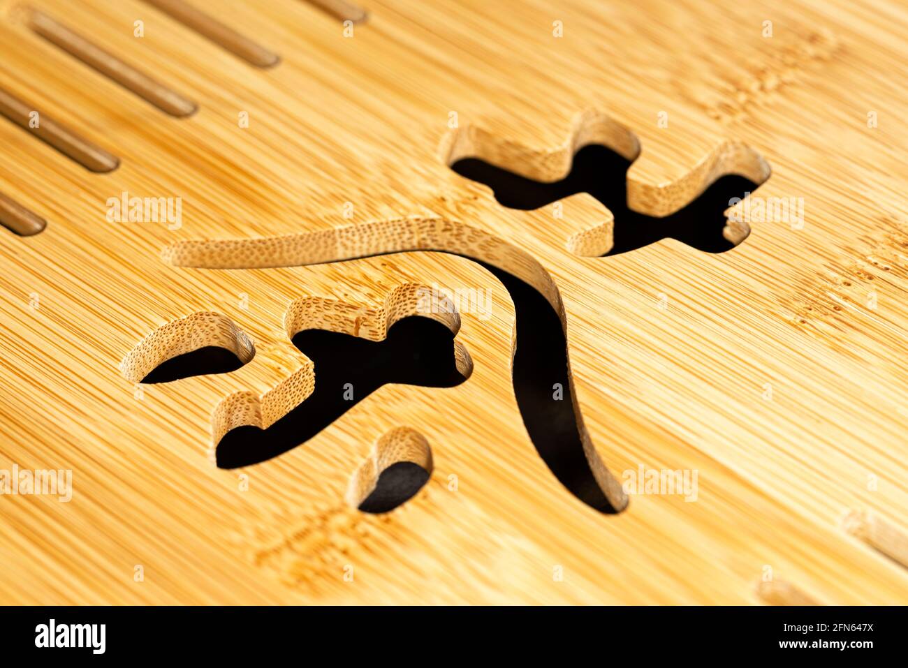 Chinese character for tea carved in bamboo board Stock Photo