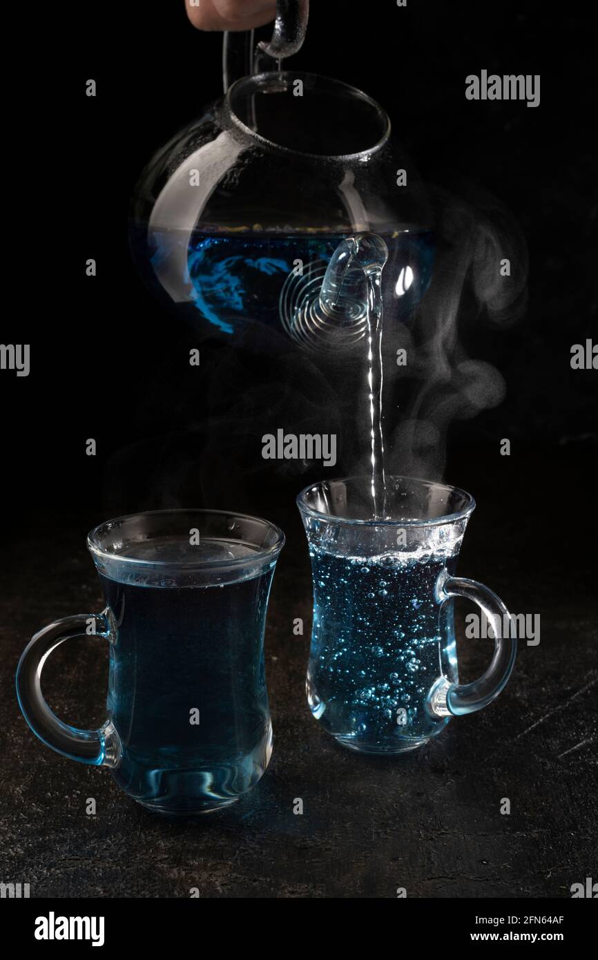 Organic blue tea Anchan, Clitoria, Butterfly Pea on black background ...