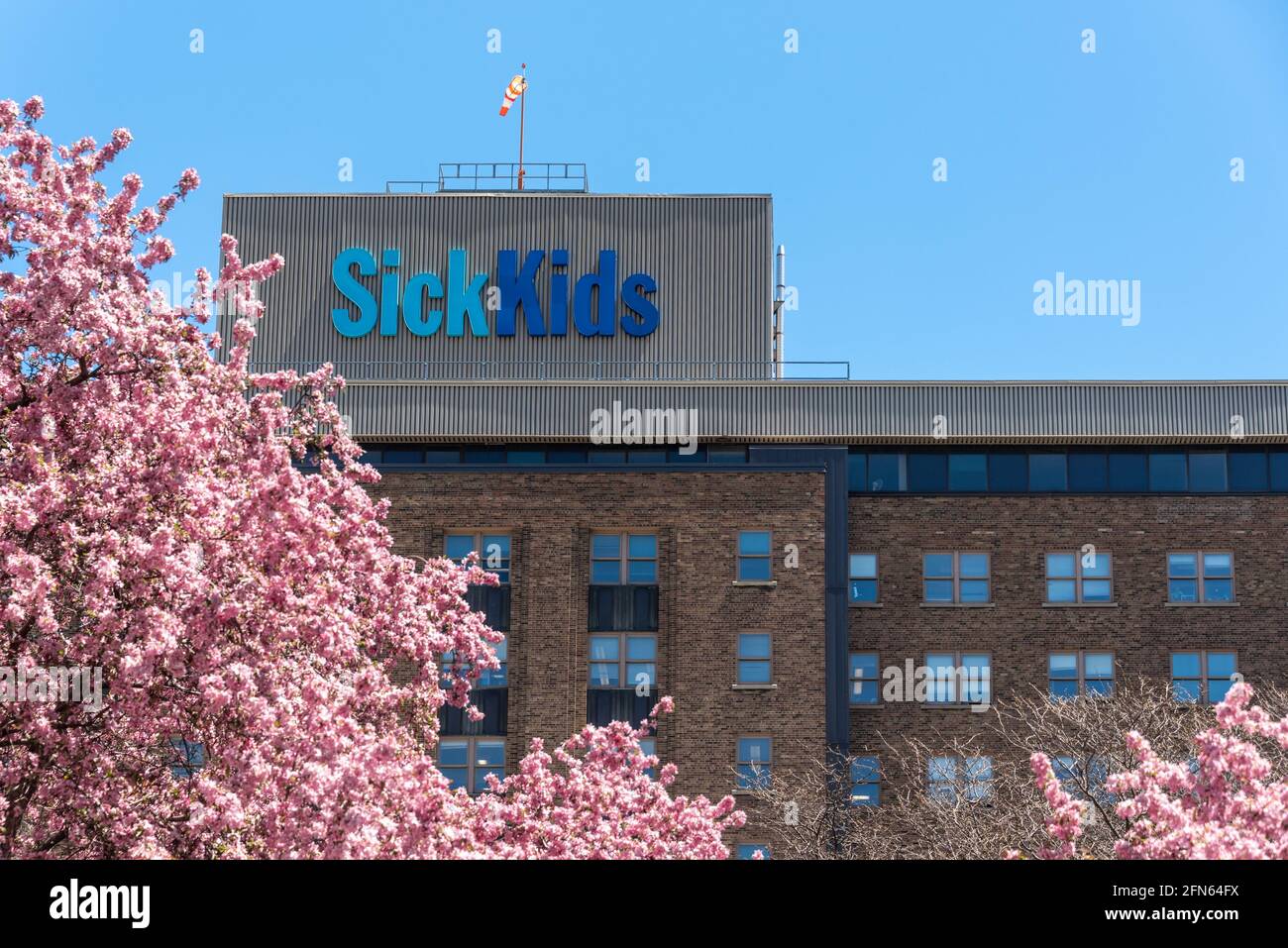 SickKids Hospital Logo on top of building. Springtime season arrival in Toronto, Canada Stock Photo