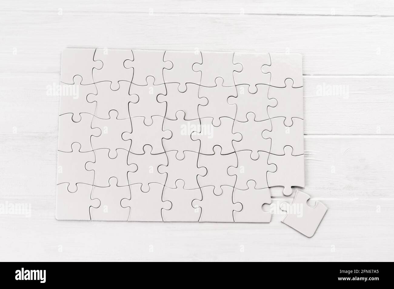Rectangular jigsaw puzzle on white table Stock Photo
