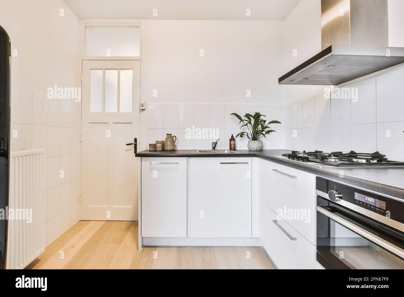 Interior of modern light kitchen Stock Photo - Alamy