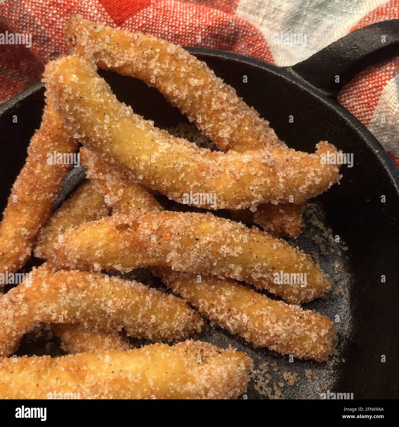Fried Churros sprinkled with Sugar Stock Photo