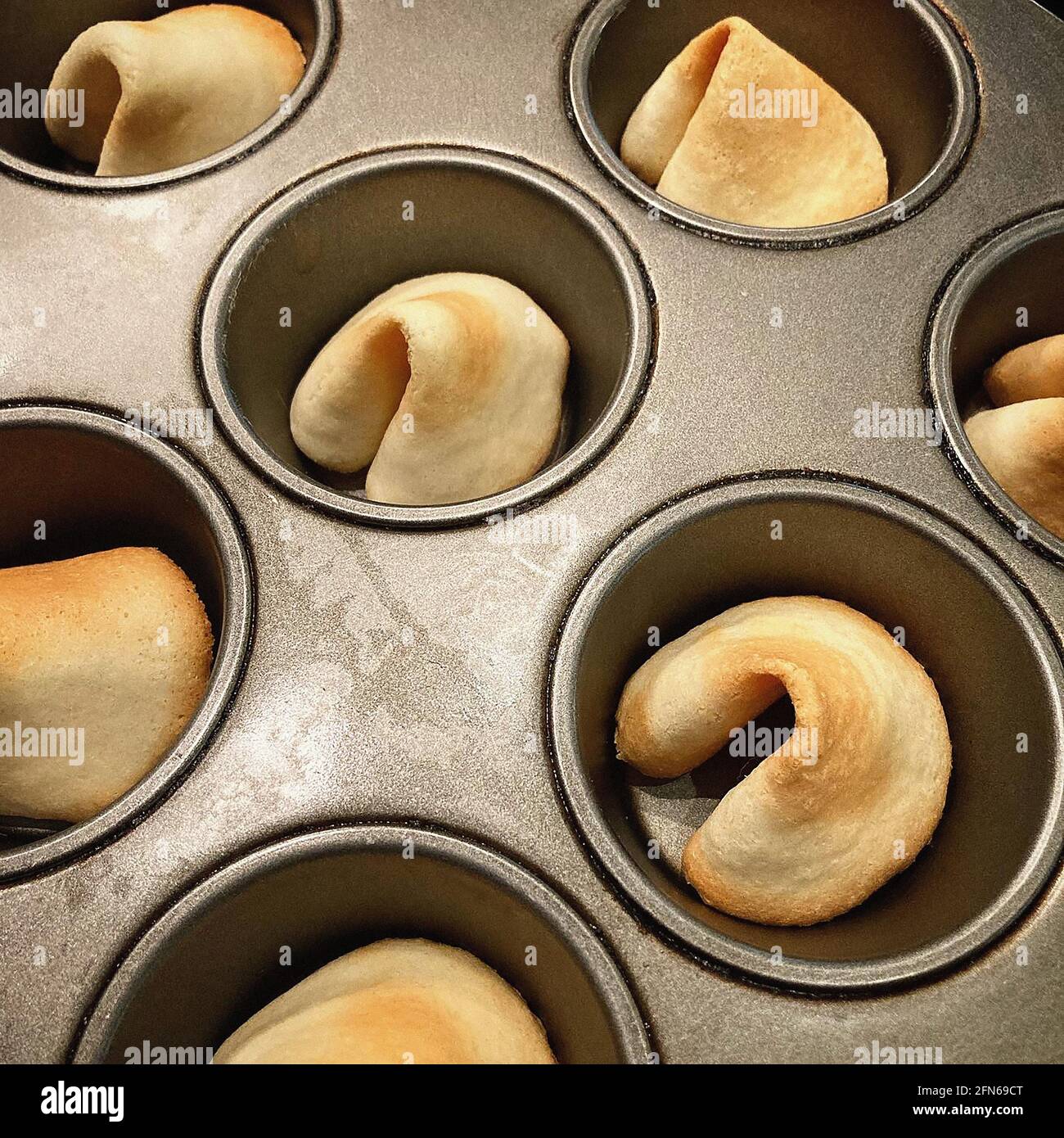 Homemade Fortune Cookies in Baking Tin Stock Photo