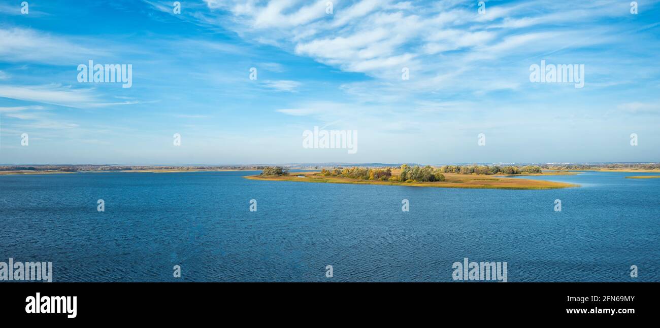 Uninhabited islands on the Volga River. Beautiful river and cloudy sky. Panoramic view.  Stock Photo