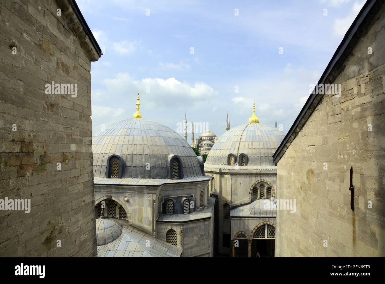 View from Hagia Sophia looking over the domed buildings to the Blue mosque in the distance. Classic view of Istanbul, Turkey. Stock Photo