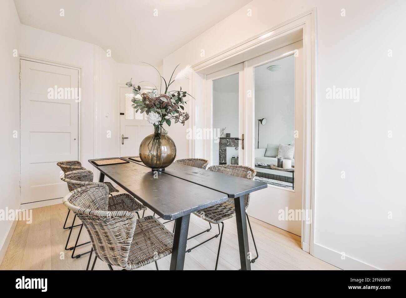 Vase with flowers on table in dining room Stock Photo Alamy