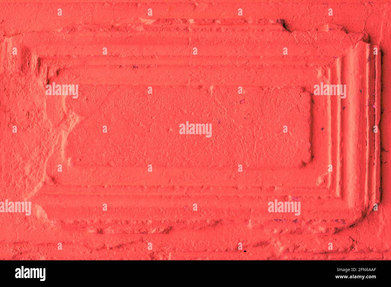 element of the old textural bright red wall, template for text, frame for an inscription Stock Photo