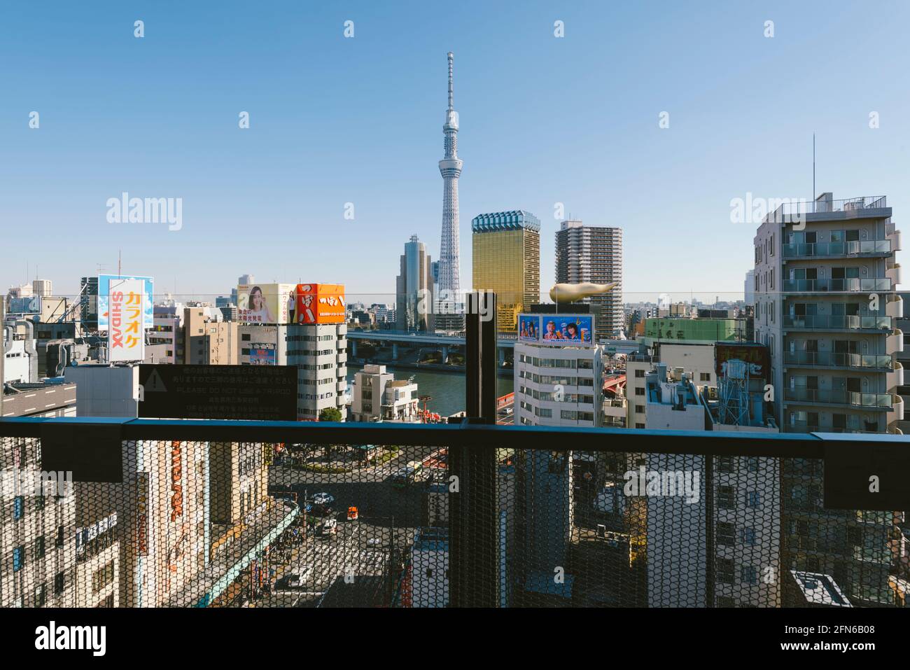 Tokyo, Japan - January 10, 2016: Japanese tourist enjoying the view from the top floor of the Asakusa Culture Tourist Information Center. Stock Photo