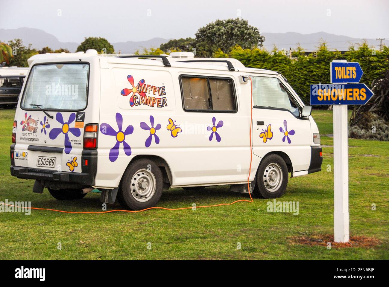 In the land of the camper vans: a colourful small camper van of a budget  rental Stock Photo - Alamy