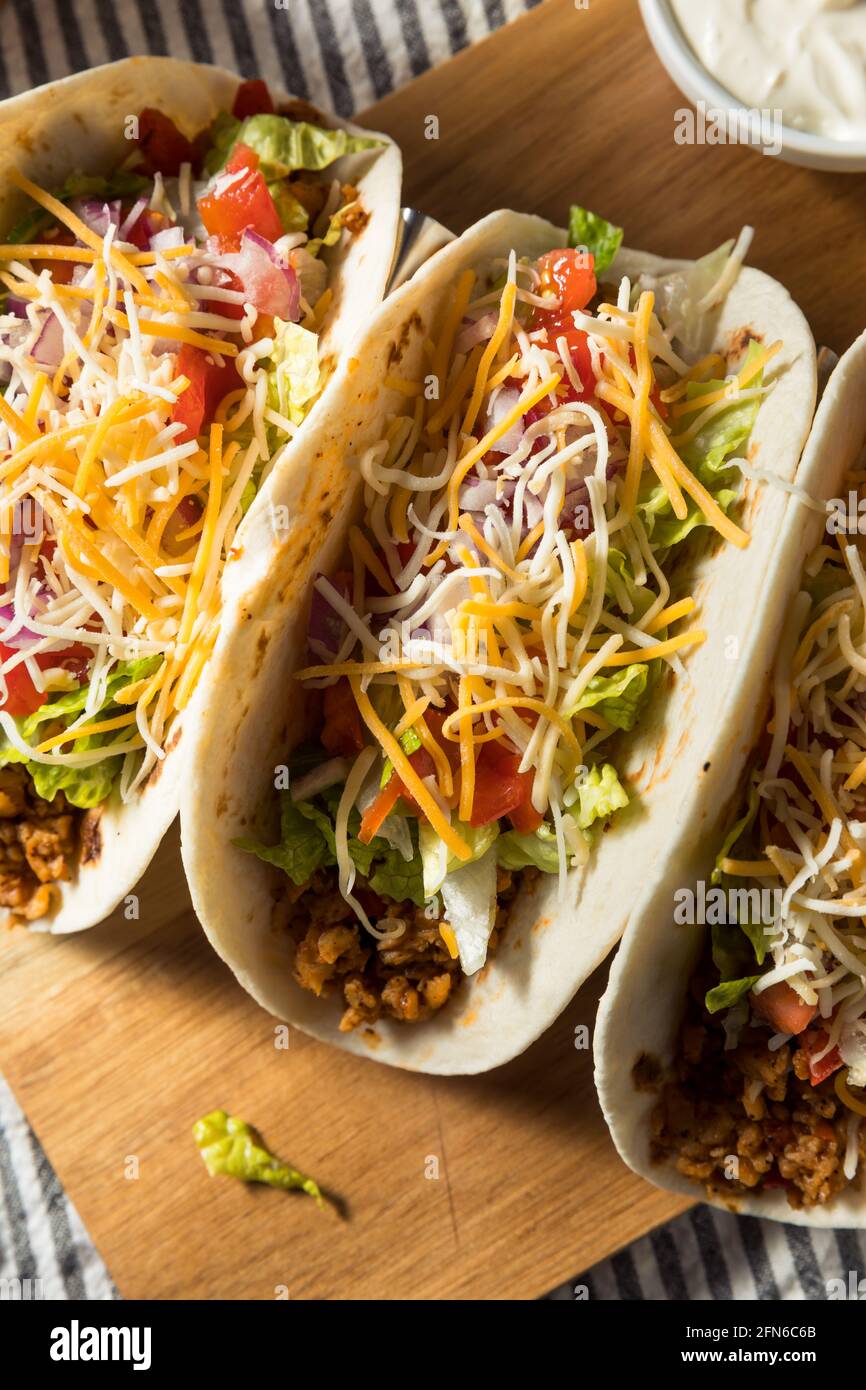 Homemade American Soft Shell Beef Tacos with Lettuce Tomato Cheese Stock Photo