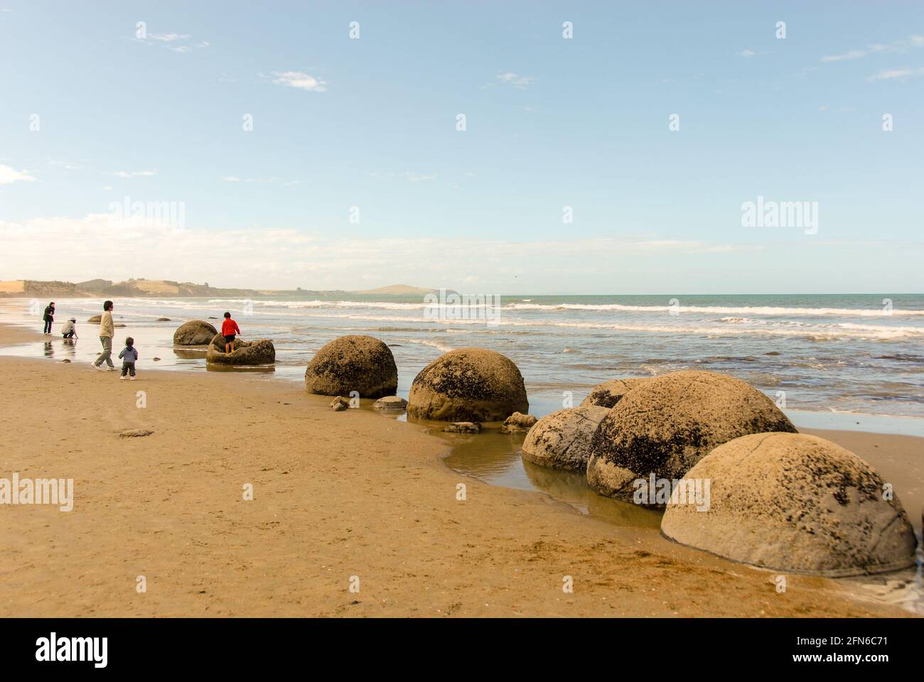 Lost marbles of a giant? The Moeraki Boulders at Koekohe Beach on New Zealand's South Island are a popular attraction for locals and tourists. Stock Photo
