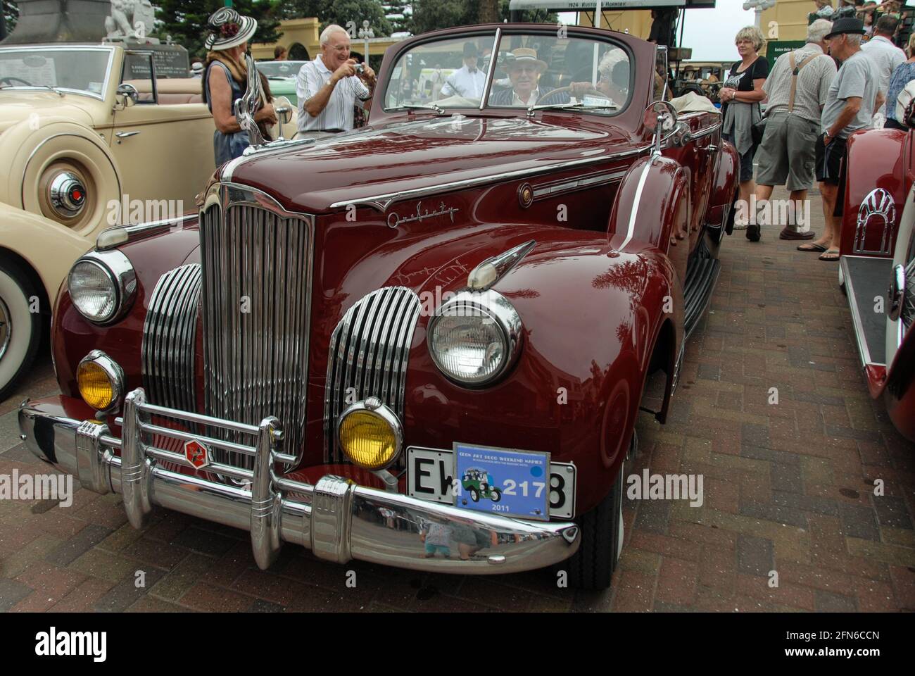 The high art of driving in style: Front view of a Packard Super Eight One-Sixty cabriolet classic car from 1941 at Art Deco Weekend in Napier. Stock Photo