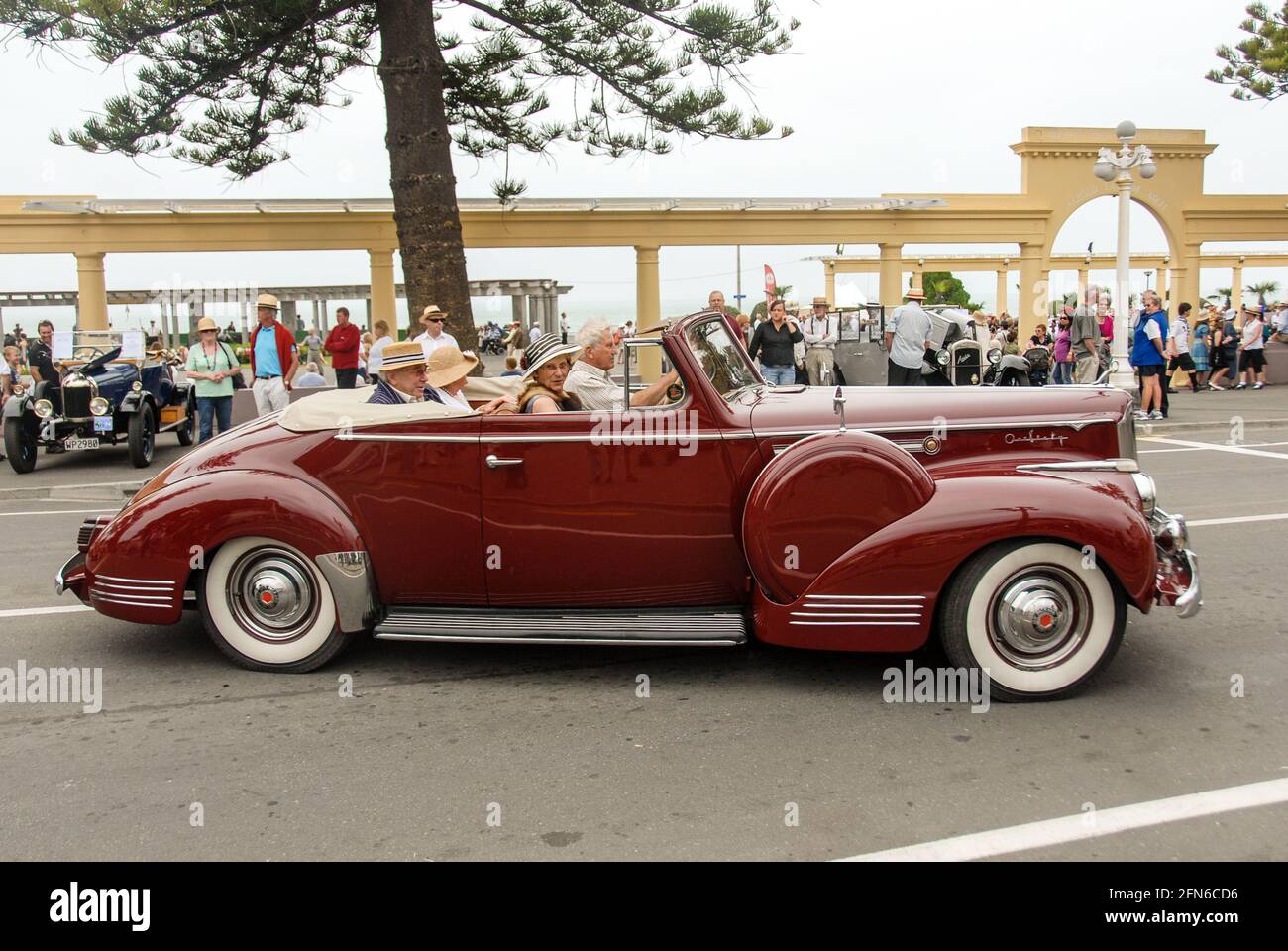 The high art of driving in style: Side view of a Packard Super Eight One-Sixty cabriolet classic car from 1941 at Art Deco Weekend in Napier. Stock Photo