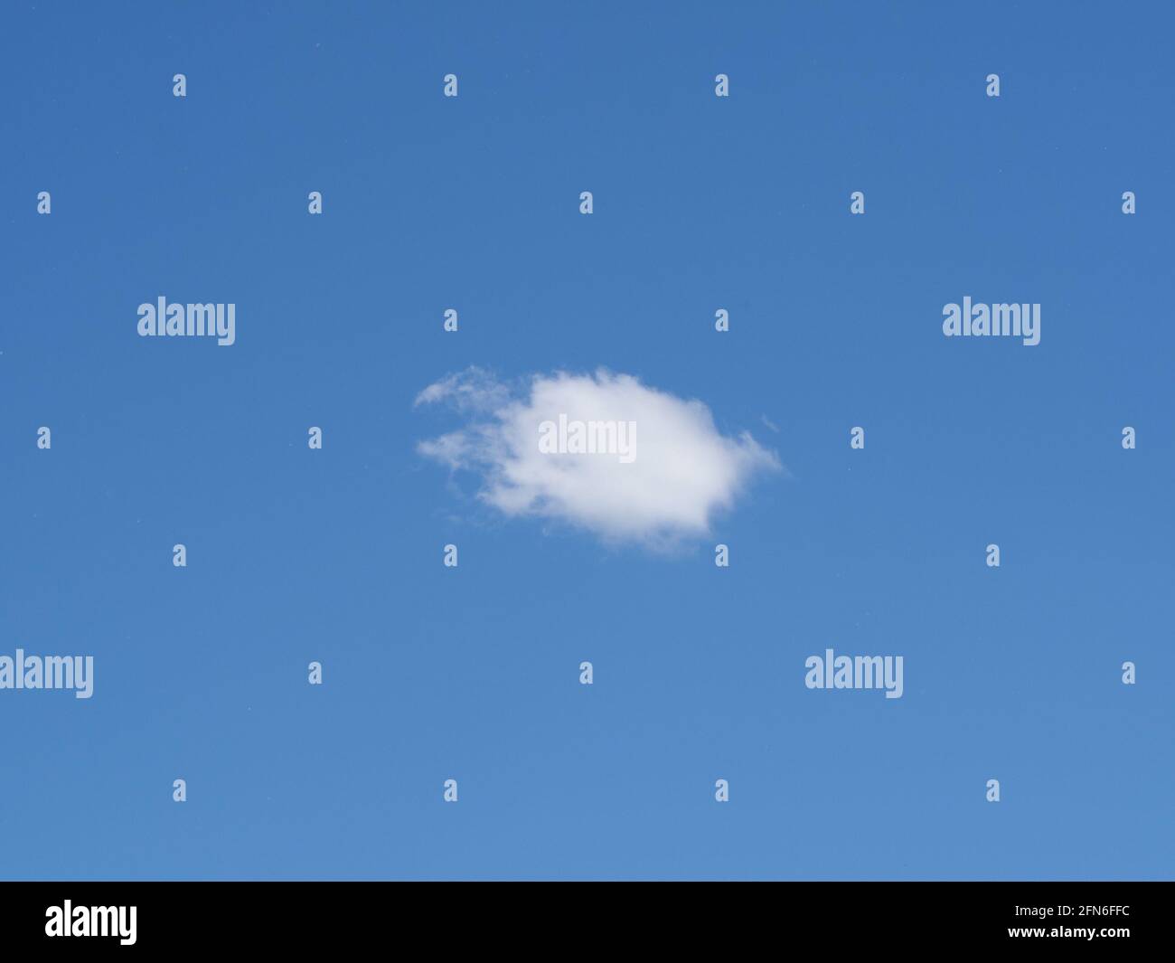 single lonely cloud in the blue sky Stock Photo