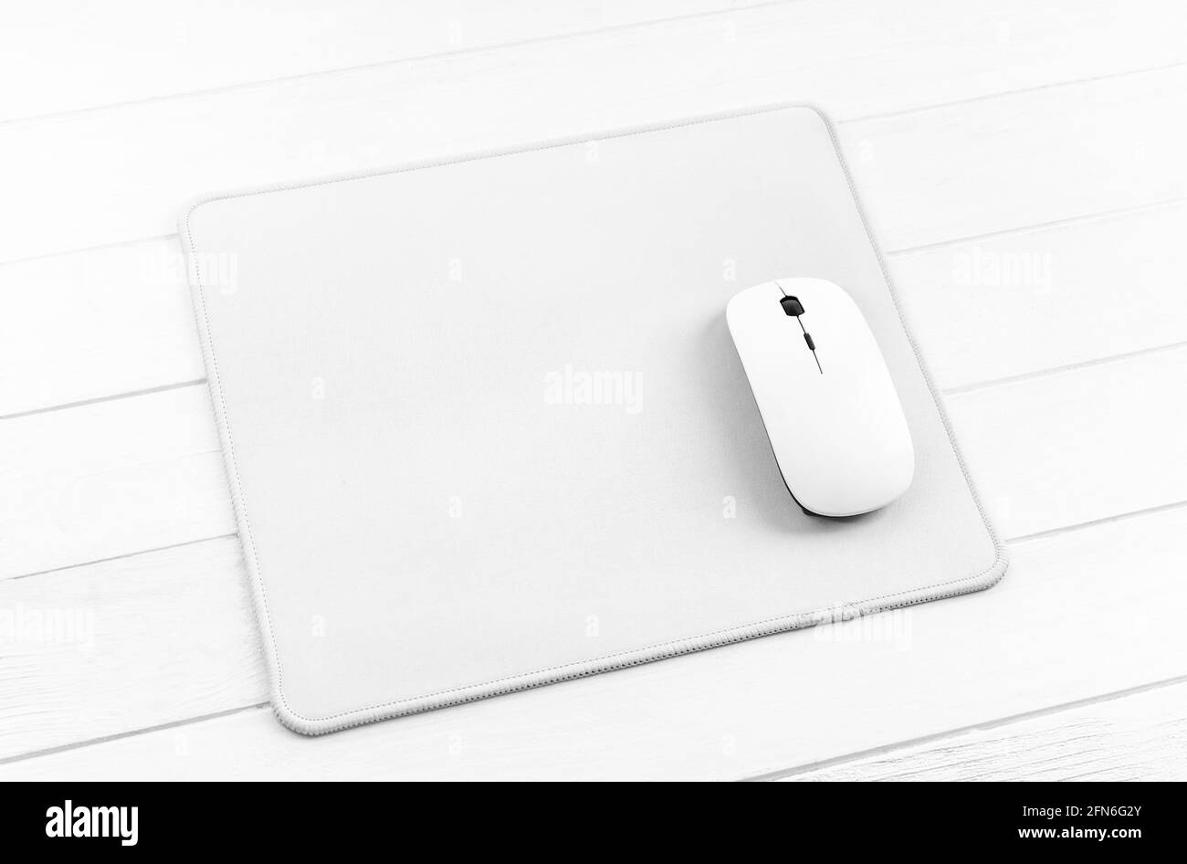 Computer mouse on white mouse pad Stock Photo - Alamy