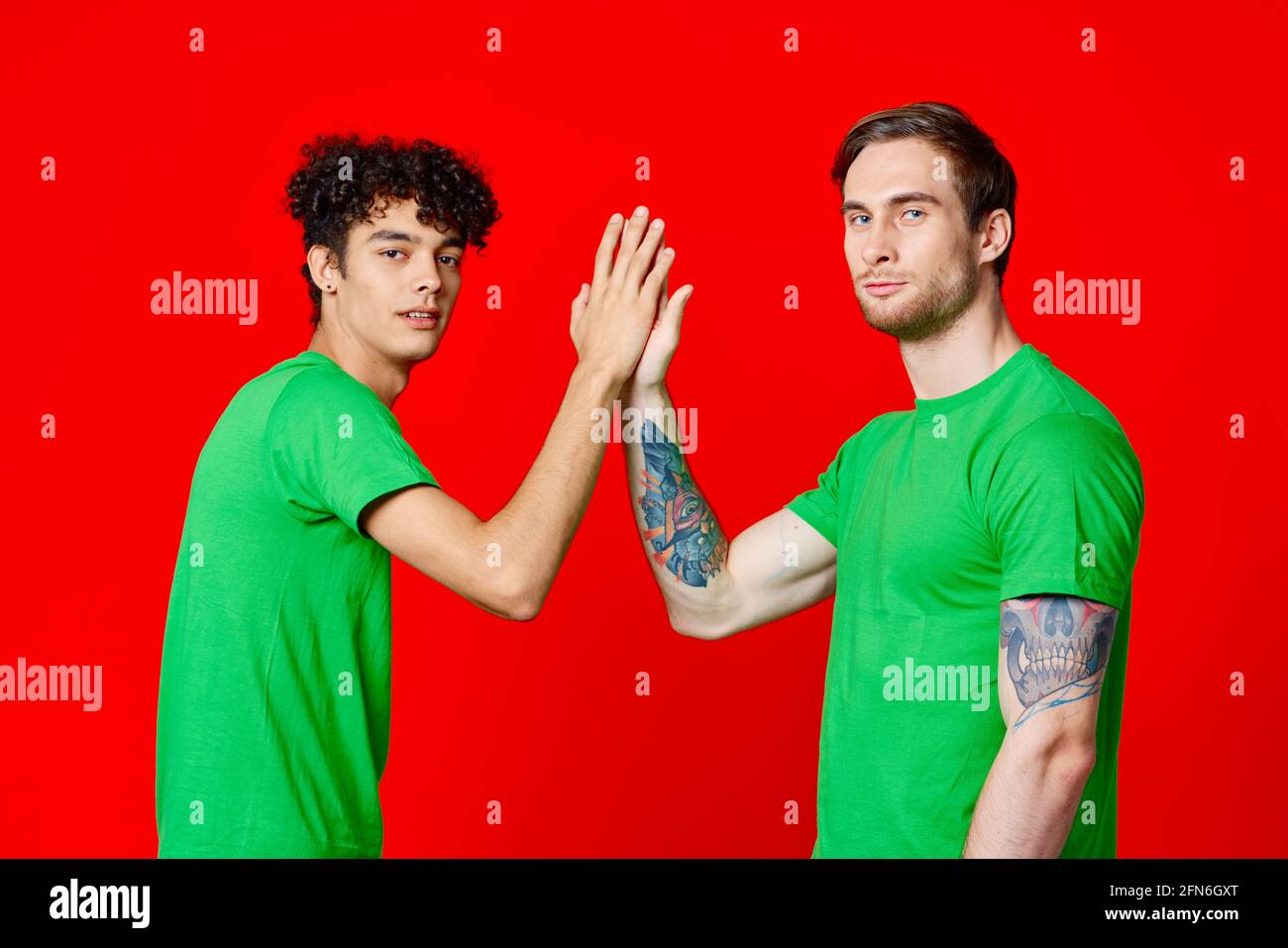 Two cheerful brothers pointing hi-res stock photography and images - Alamy