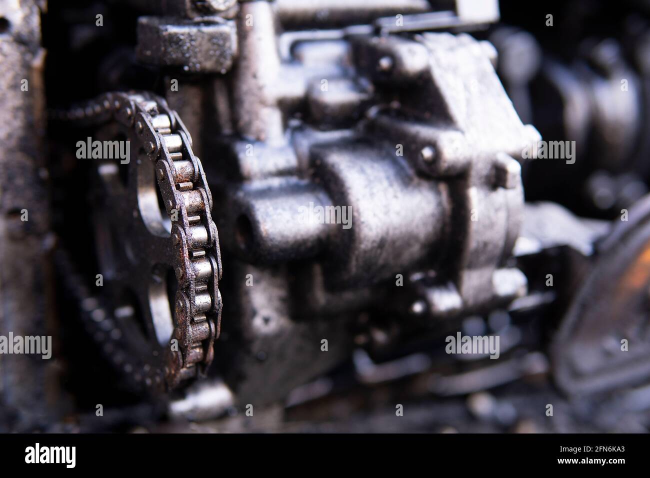 4 cylinder one motor head with disassembled exhaust manifold of old industrial heavy truck V 8 diesel engine with separate covers closeup, vehicle Stock Photo