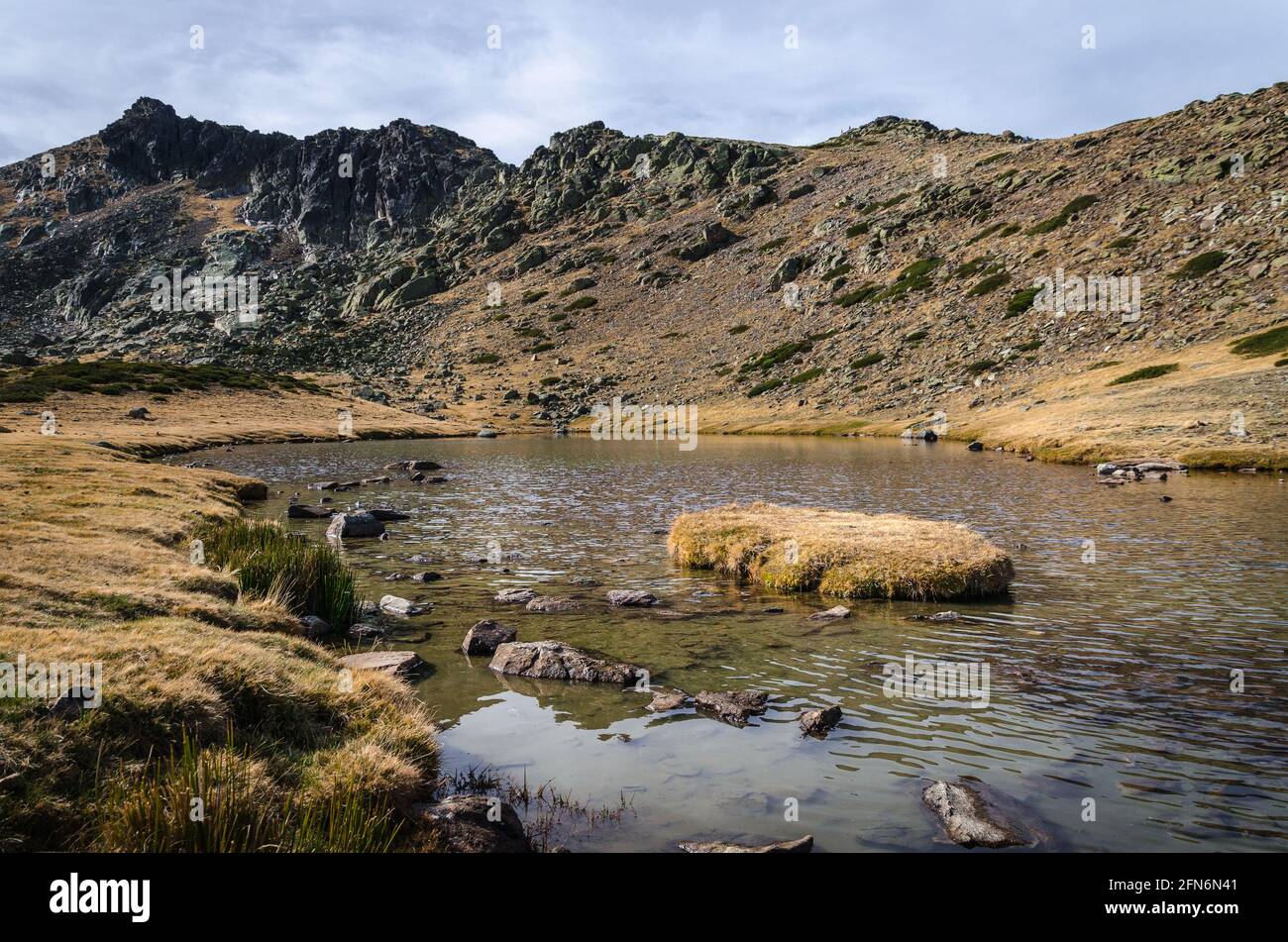 Lake on a rocky mountain landscape on Guadarrama mountain range, Peñalara, Madrid, Spain Stock Photo