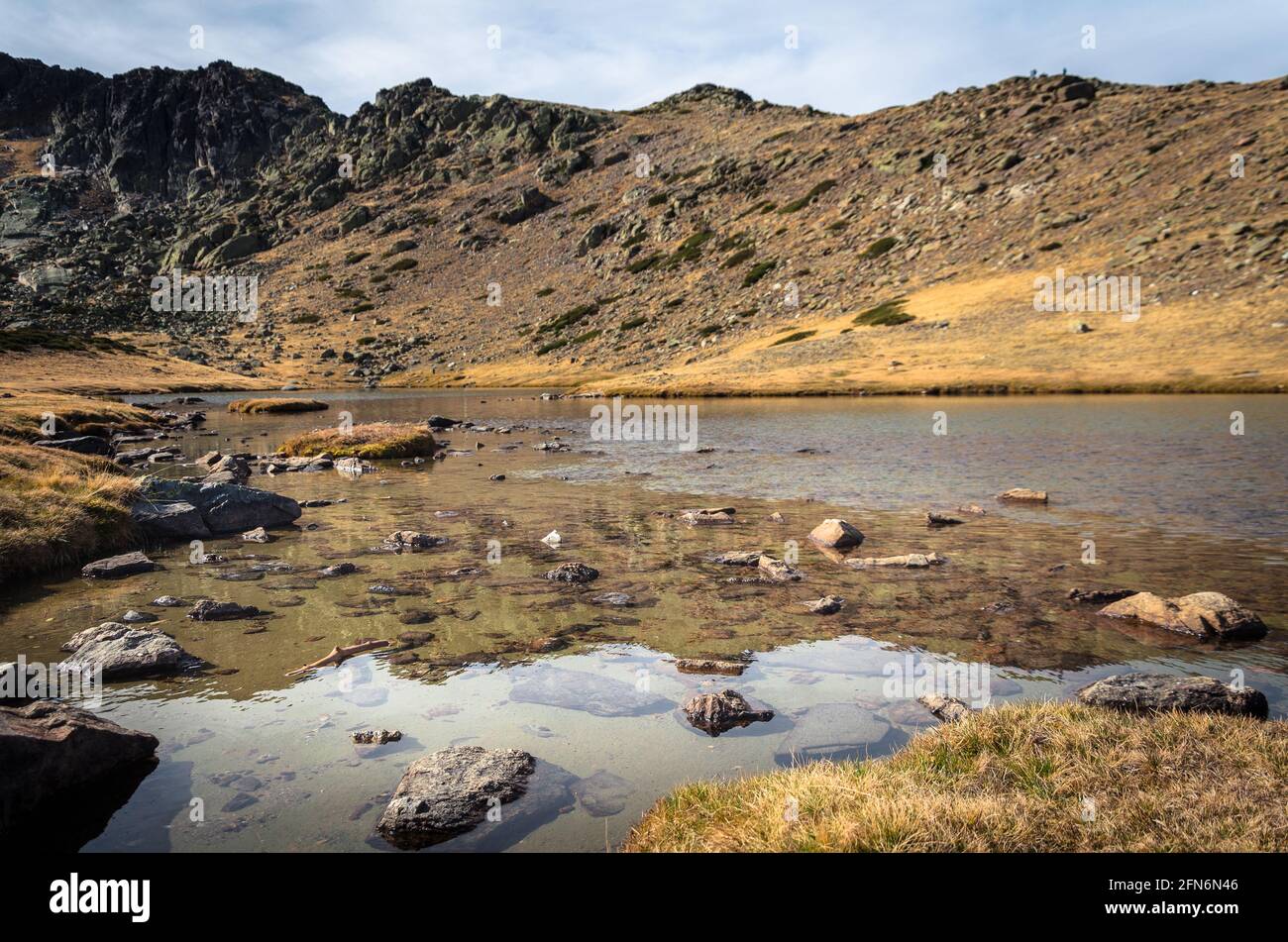 Lake on a rocky mountain landscape on Guadarrama mountain range, Peñalara, Madrid, Spain Stock Photo