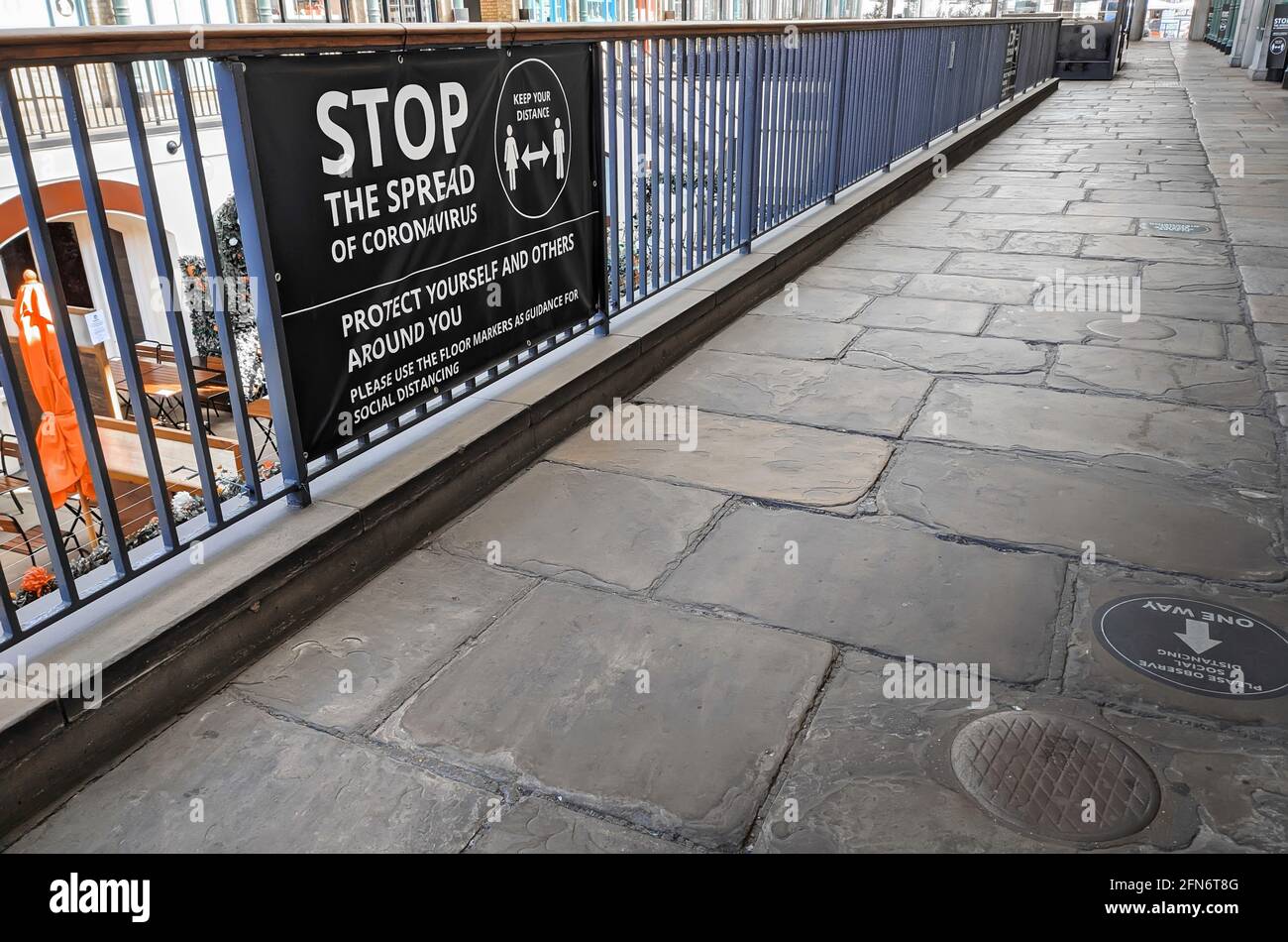 View of Coronavirus Social Distancing Sign during Covid-19 Pandemic in Covent Garden in London Stock Photo