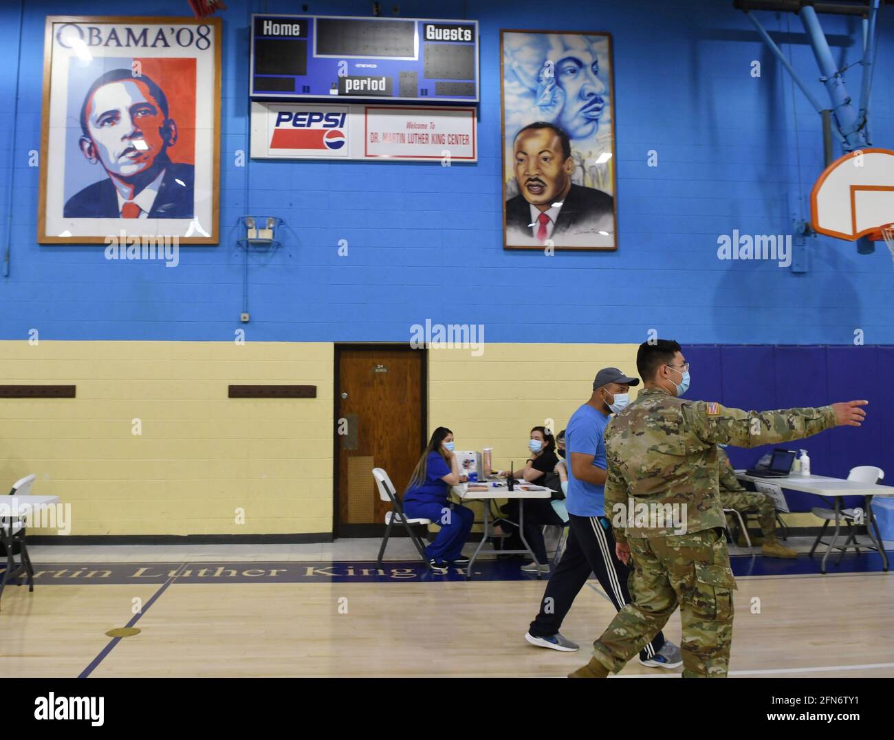 Racine, Wisconsin, USA. 14th May, 2021. Large portraits of former president Barack Obama and Rev. Martin Luther King Jr. hang in the gymnasium of the King Community Center in Racine, Wisconsin where the city health department held a COVID-19 vaccination clinic with the help of the Wisconsin National Guard Friday May 14, 2021. Doses of the Pfizer vaccine were administered to people. No appointments were necessary. (Credit Image: © Mark HertzbergZUMA Wire) Stock Photo