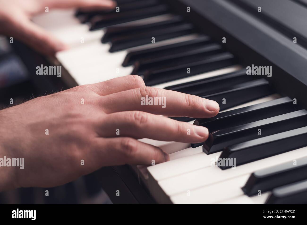 Man playing piano close up Stock Photo