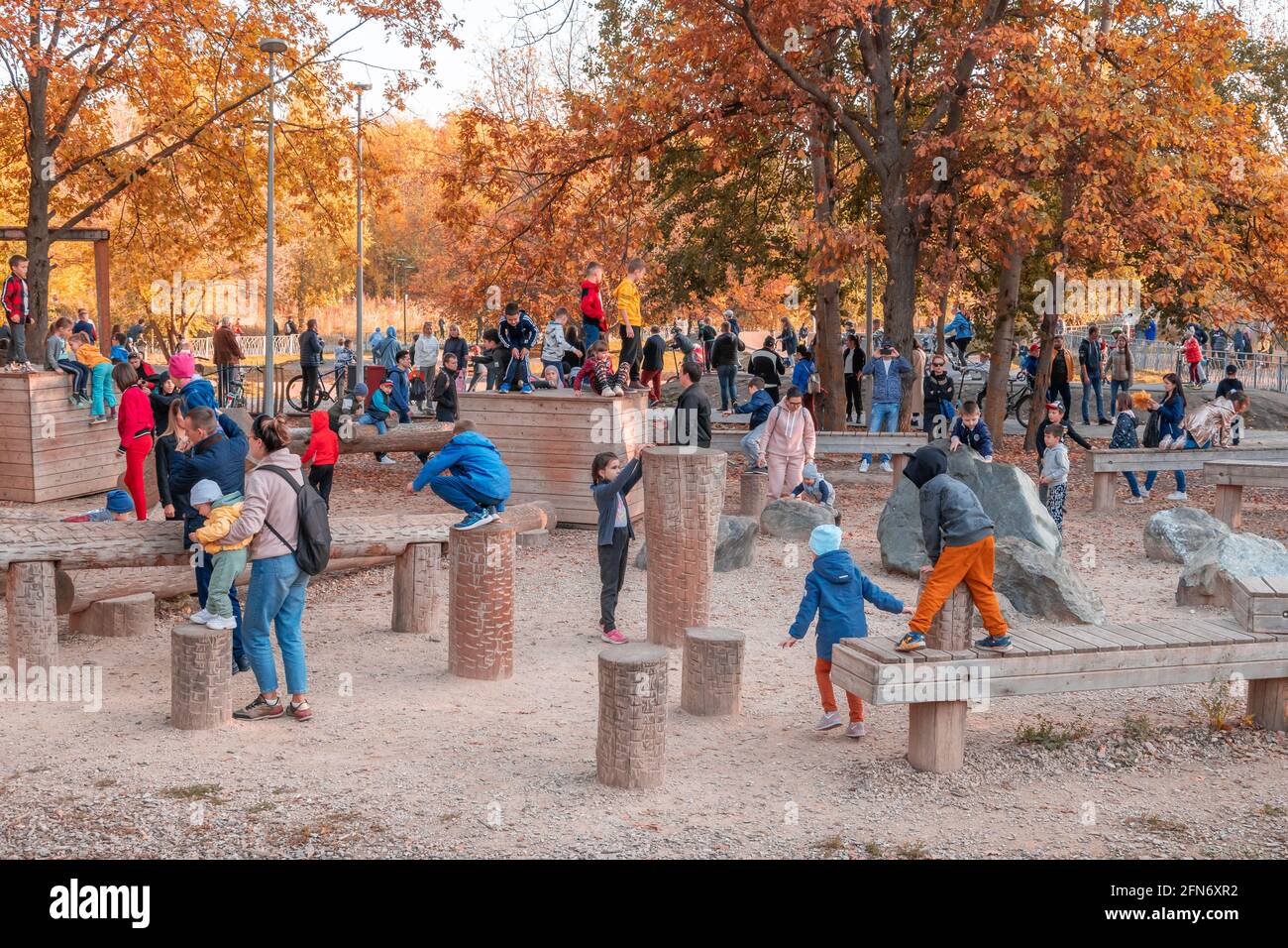 Kazan, Russia - October 03, 2020: Children under the supervision of their parents play on the playground in the city's public park on an autumn sunny Stock Photo