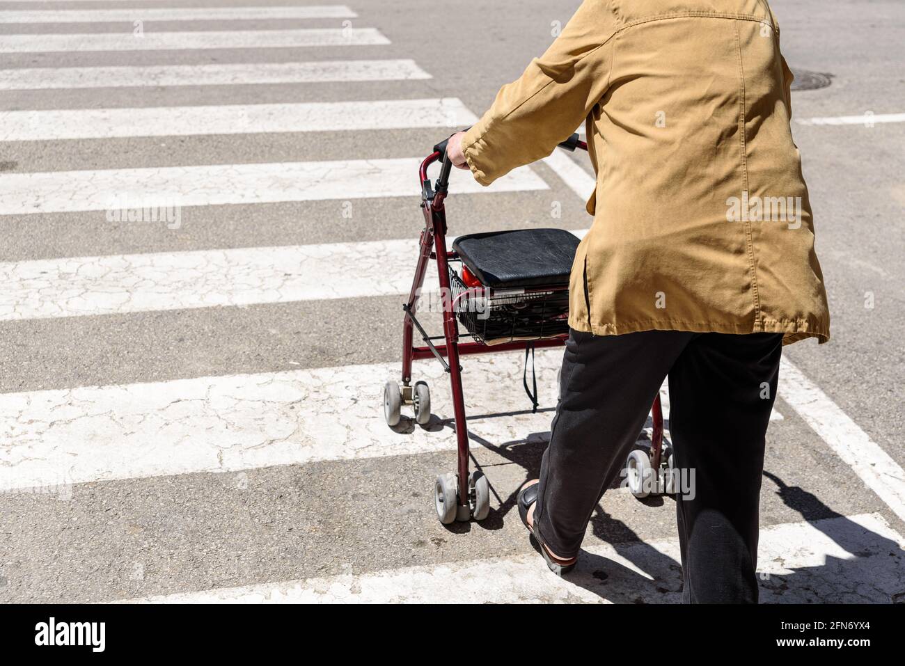 Elderly woman rollator wheeled walker hi-res stock photography and ...