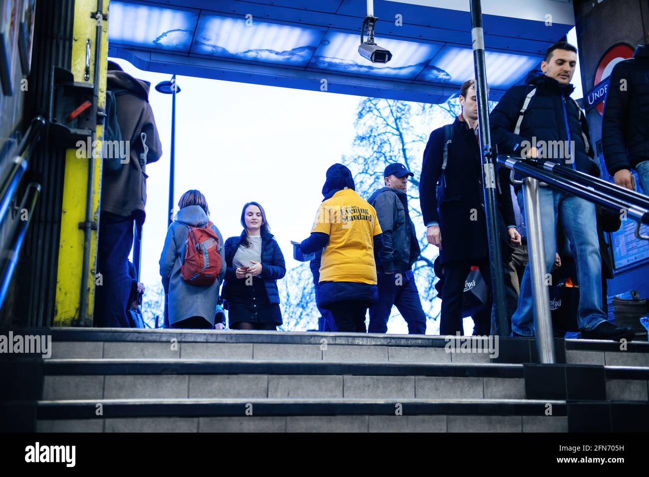 Low angle view of woman distributing Evening Standard Stock Photo