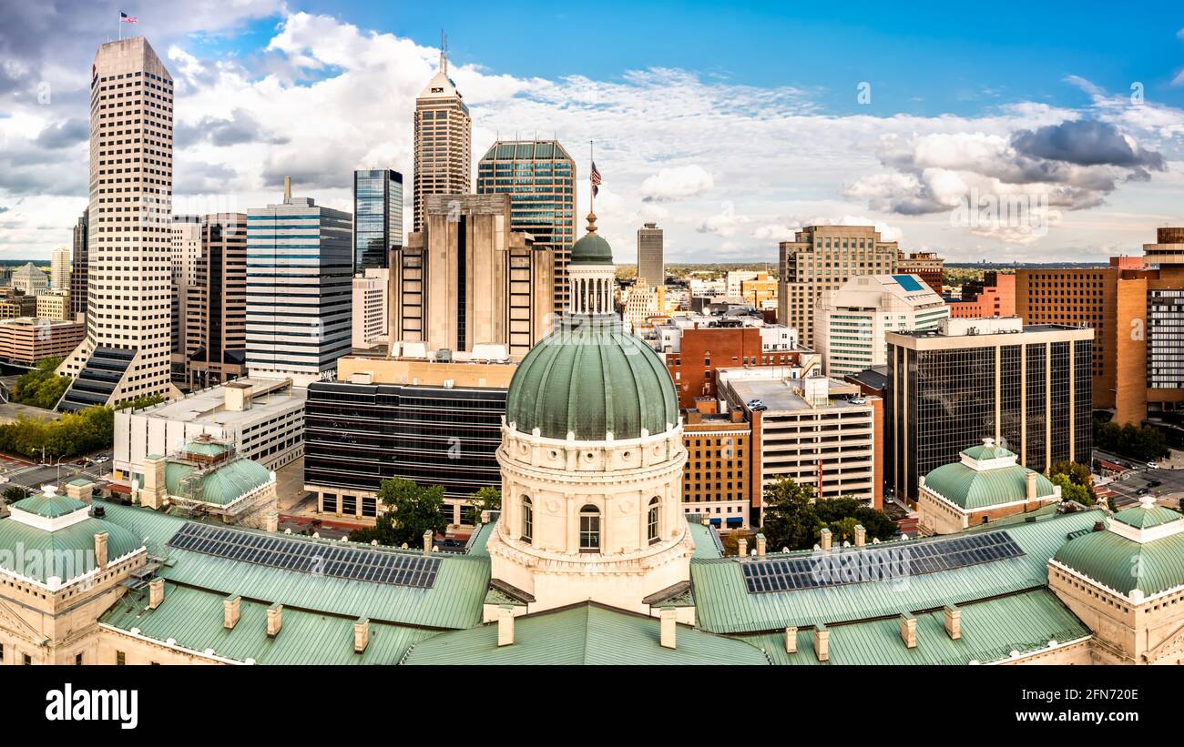 Indiana Statehouse and Indianapolis skyline on a sunny afternoon. Stock Photo