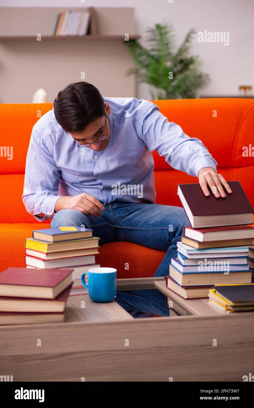 Young student preparing for exams at home Stock Photo - Alamy