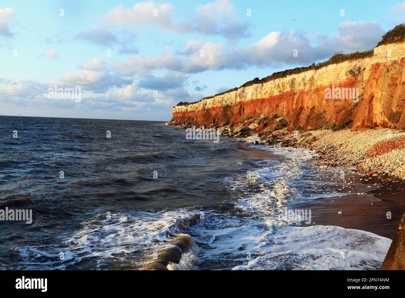 Hunstanton Cliffs, striped pattern, waves, high tide,  surf, The Wash, North Sea, Norfolk, England, UK Stock Photo
