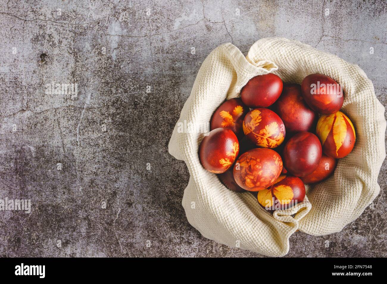 Top down flat lay view on easter eggs painted and decorated on marble background with copy space Stock Photo