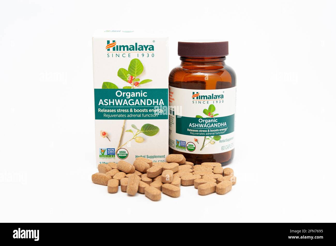 Fuji City, Shizuoka-Ken, Japan - April 30, 2021: Nutritional supplement Ashwagandha by Himalaya with scattered caplets. Isolated on white background. Stock Photo