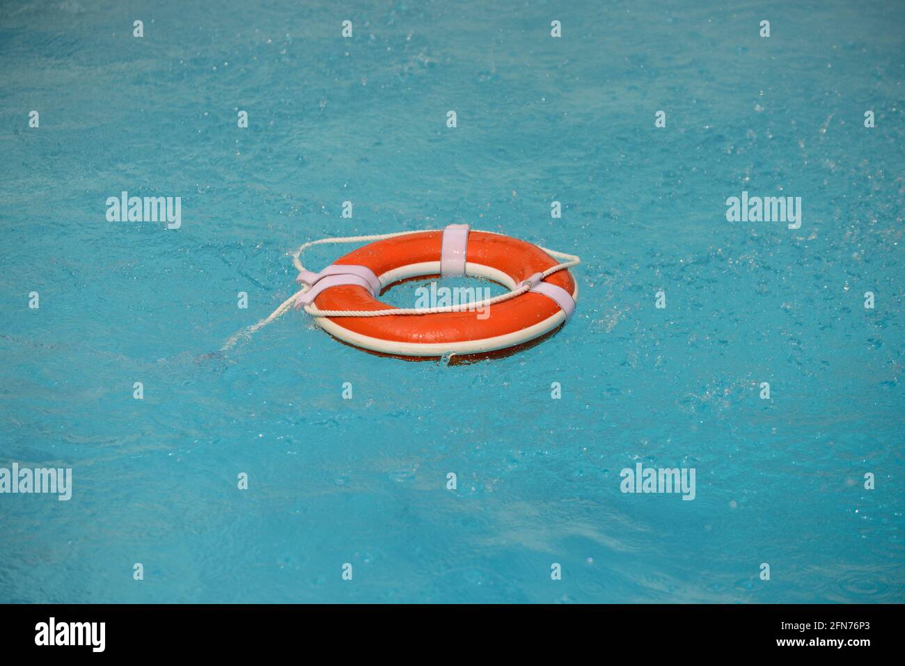 No swimming. Water rescue emergency equipment. Rescue ring floating in ...