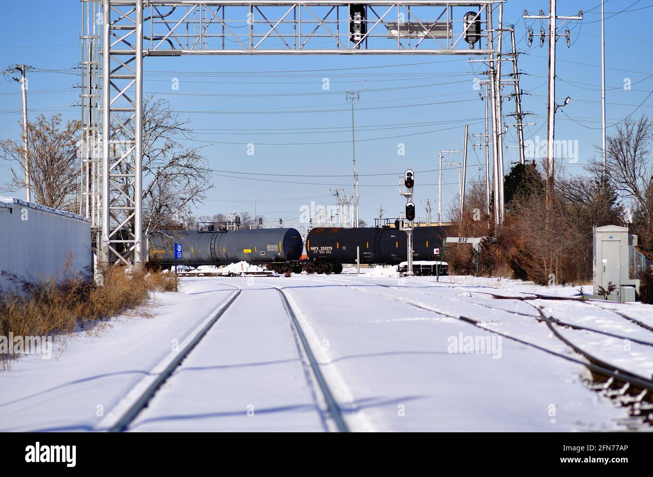 Franklin Park, Illinois, USA. A Canadian Pacific Railway freight train after leaving the railway's Bensenville Yard passing through a diamond crossing. Stock Photo