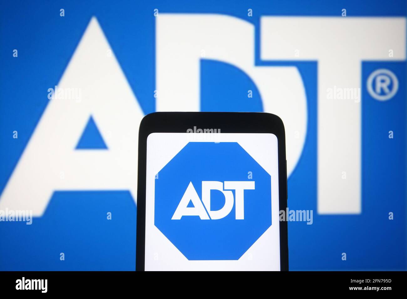Ukraine. 14th May, 2021. In this photo illustration the ADT logo of ADT Security Services is seen on a smartphone and a pc screen. (Photo by Pavlo Gonchar/SOPA Images/Sipa USA) Credit: Sipa USA/Alamy Live News Stock Photo