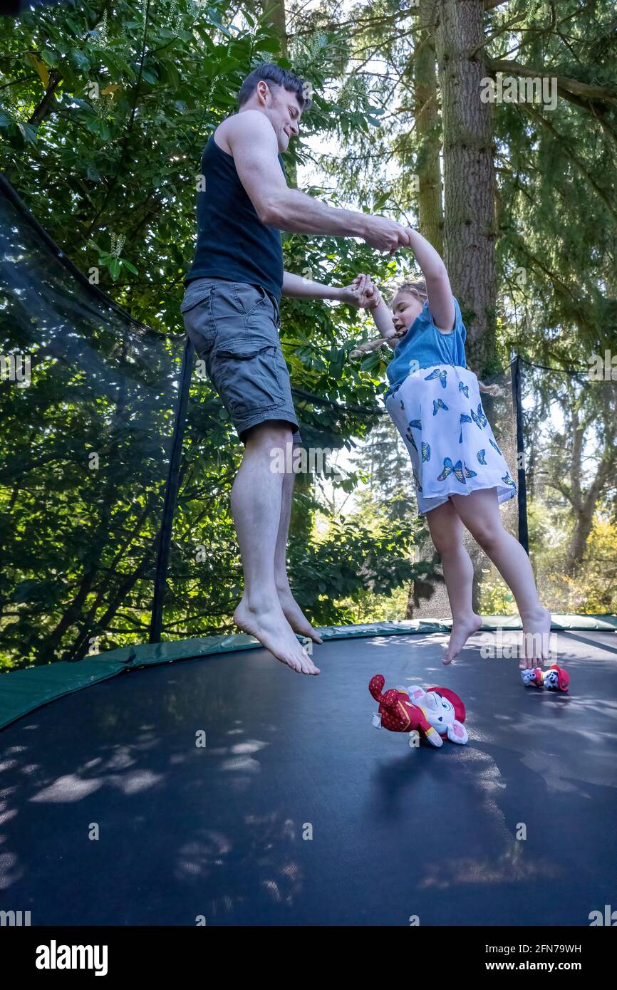 Lynwood Washington Usa Four Year Old Girl And Her Father Bouncing On A Trampoline In Their 1972