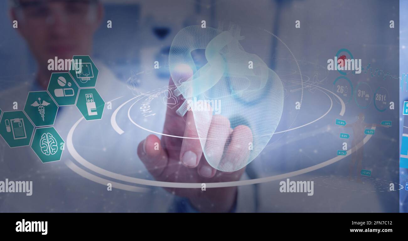 Medical data processing against male doctor wearing protective glasses ...