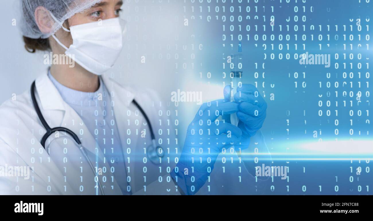 Composition of binary coding over doctor with syringe in face mask Stock Photo