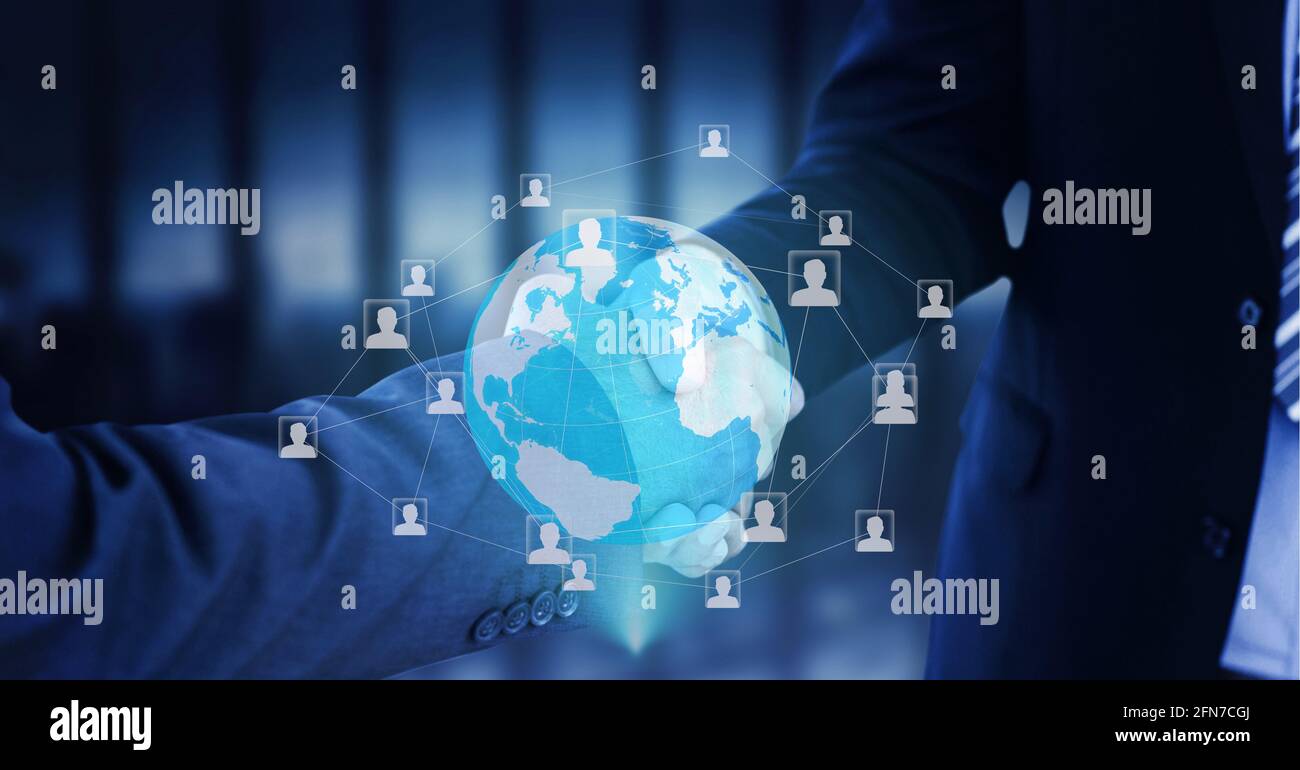 Network of profile icons over globe against mid section of two businessmen shaking hands Stock Photo