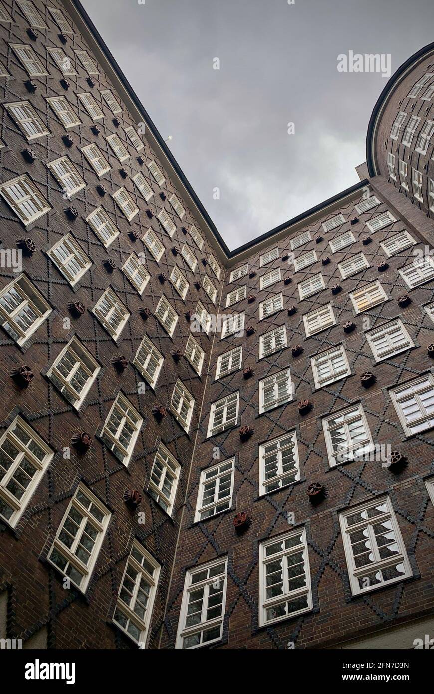 Low angle shot of an old facade building with white windows under ...
